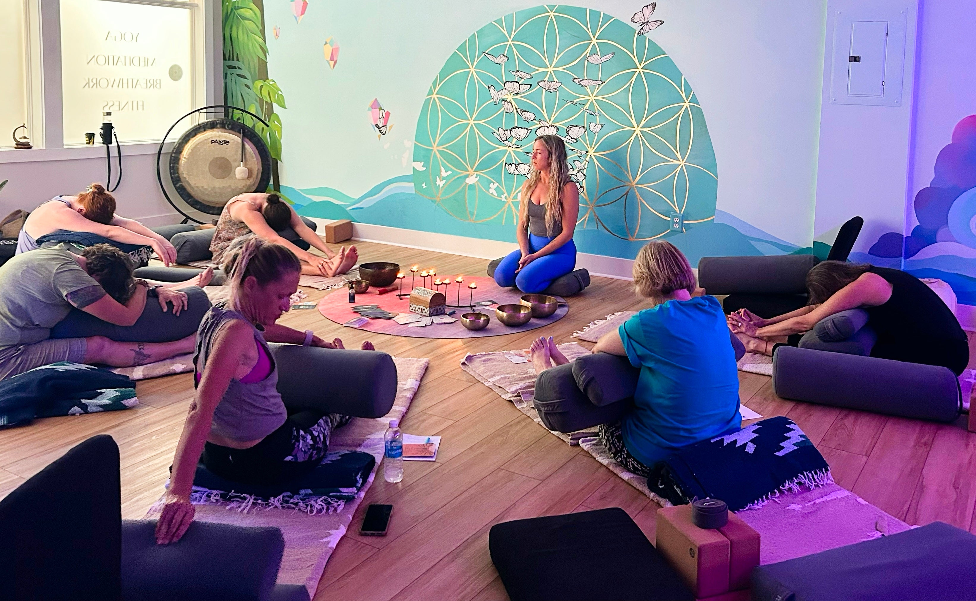 group-yoga-session-with-instructor-in-front-of-meditation-altar-key-west